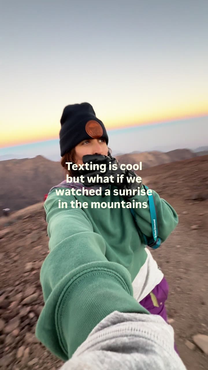 Makenna hiking in the dark and reaching a mountain summit at sunrise, text reading 'texting is cool but what if we watched a sunrise in the mountains'