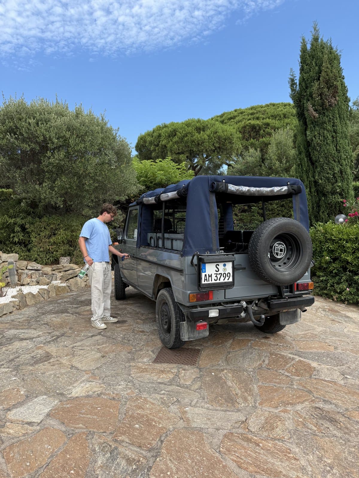 A jeep parked along a coastal road