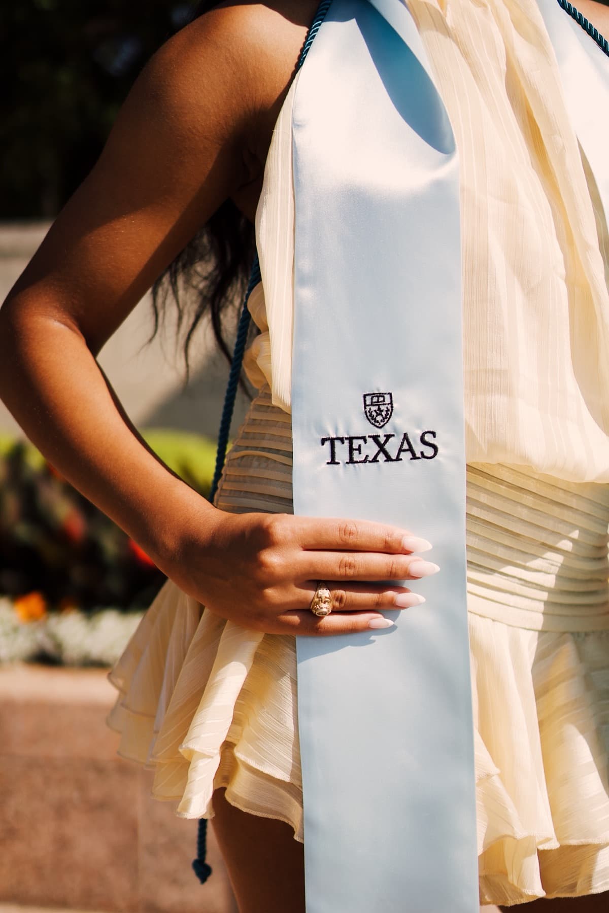 A close-up detail shot of a graduation stole